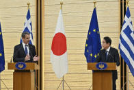 Greek Prime Minister Kyriakos Mitsotakis, left, speaks during a joint press conference with Japanese Prime Minister Fumio Kishida following their meeting at the prime minister's official residence in Tokyo, Monday, Jan. 30, 2023. (Richard A. Brooks/Pool Photo via AP)