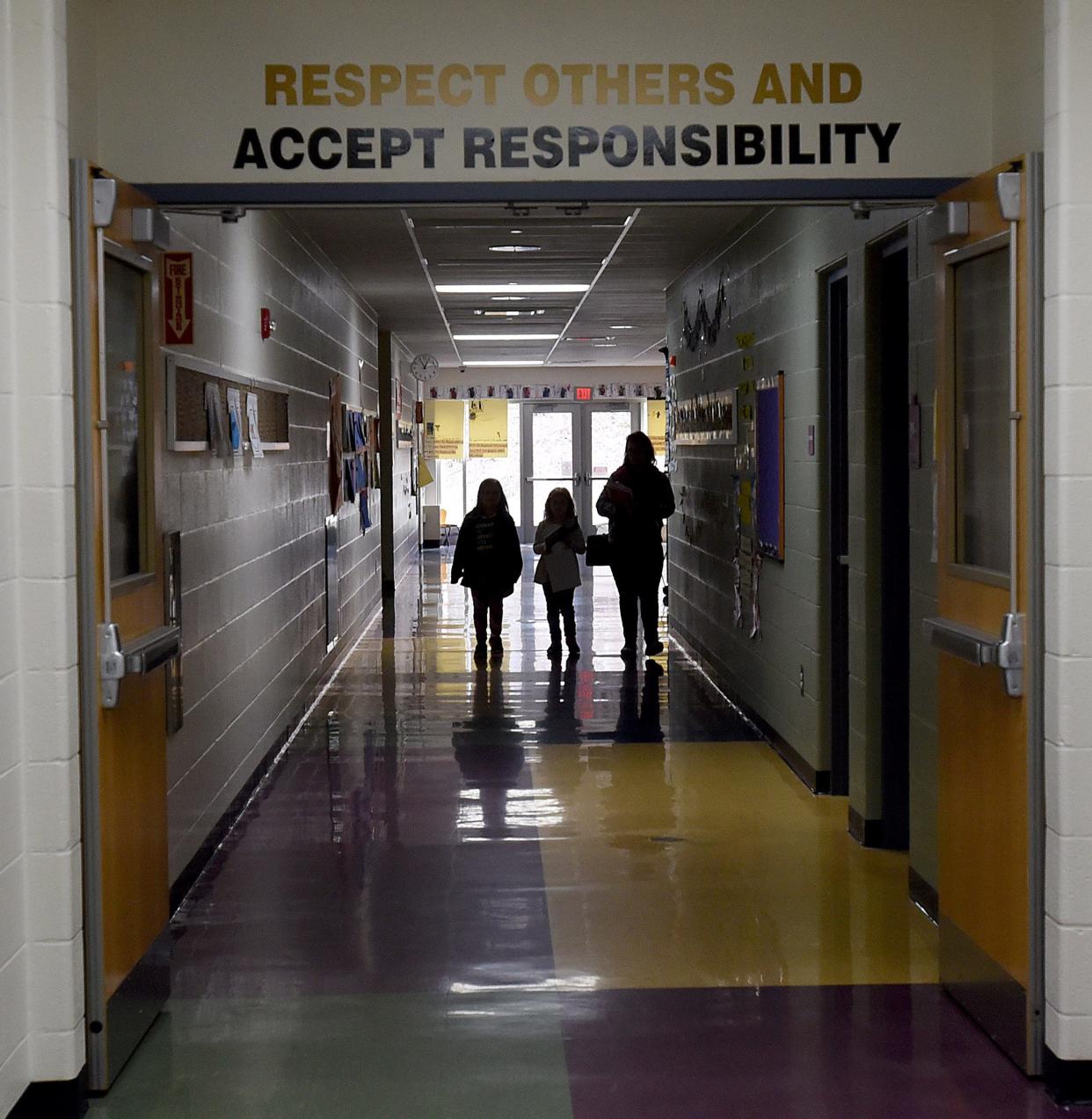 Students and parents visit Carson Elementary to pick up any left behind items and educational materials during the height of the COVID-19 pandemic. The disease continued to cause attendance issues during the 2021-22 school year.