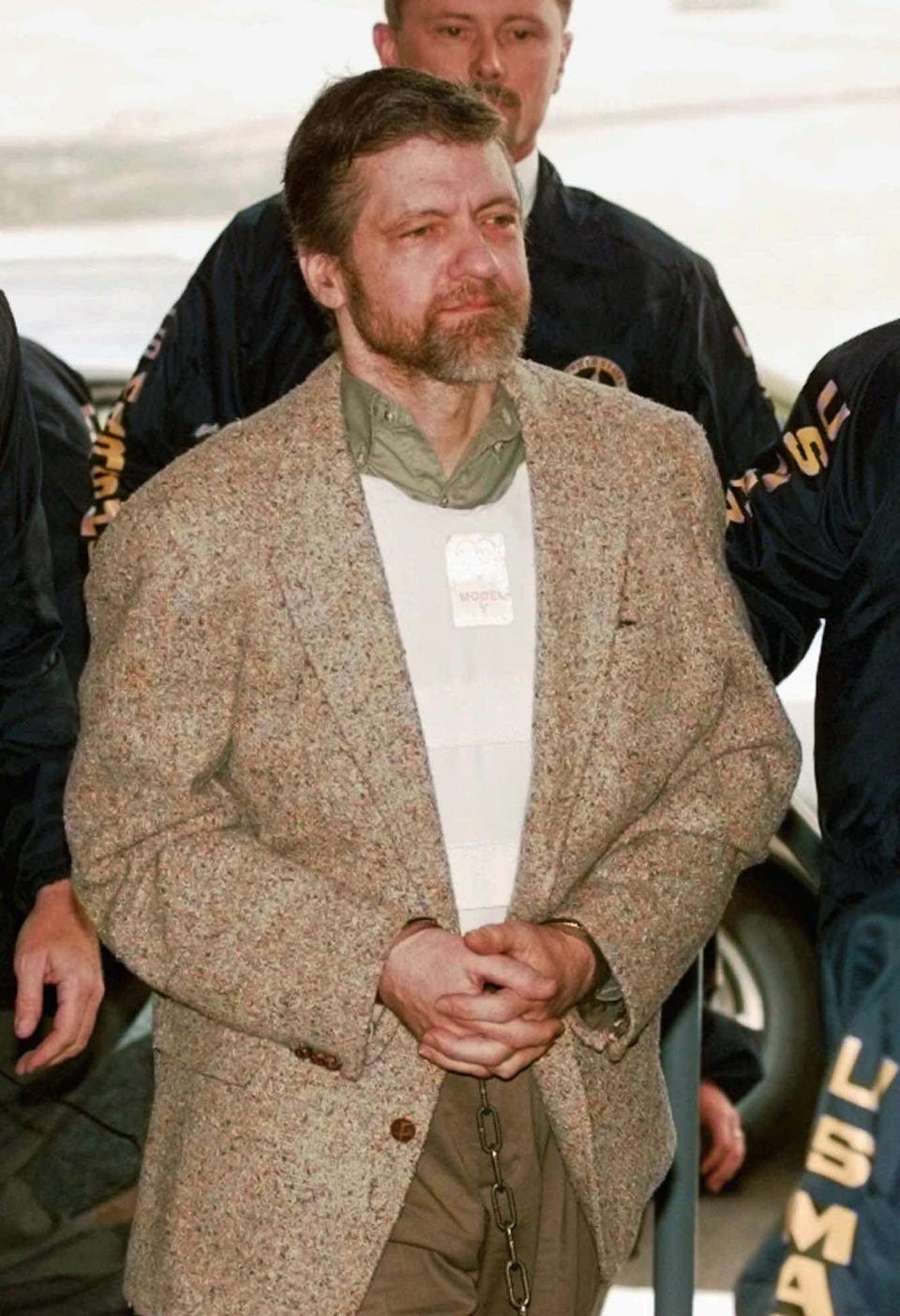 FILE-- In this June 21, 1997 file photo is Theodore Kaczynski, the convicted Unabomber who is serving a life sentence in a federal prison in Colorado for carrying out a series of mail bombings that killed three people. A federal grand jury in San Francisco indicted Vladislav Victorvic Timoshchuk, on charges of of mailing two envelopes containing ricin to Pelican Bay State Prison, officials announced on Friday Feb. 21, 2020. Last year the federal Bureau of Prisons intercepted a Christmas card from Timoshchuk, now living in Belarus, to Kaczynski, in which authorities say Timoshchuk discussed his plan to mail ricin to the United States. (AP Photo/Elaine Thompson, File)