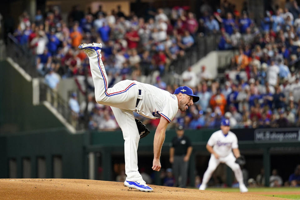 Texas Rangers starting pitcher Max Scherzer throws against the Houston Astros during the first inning in Game 3 of the baseball American League Championship Series Wednesday, Oct. 18, 2023, in Arlington, Texas. (AP Photo/Julio Cortez)