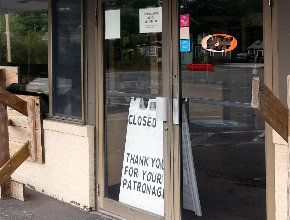 Signs explain that the Cape's last A & W is on the block.