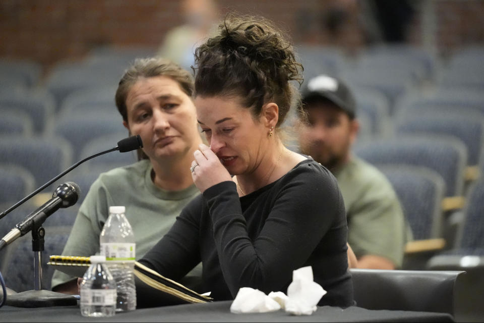 Katie Card, sister-in-law of shooter Robert Card, testifies, Thursday, May 16, 2024, in Augusta, Maine, during a hearing of the independent commission investigating the law enforcement response to the mass shooting in Lewiston, Maine. (AP Photo/Robert F. Bukaty)