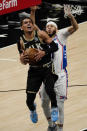 Atlanta Hawks guard Trae Young (11) goes up for a basket as Philadelphia 76ers guard Seth Curry (31) defends during the second half of Game 6 of an NBA basketball Eastern Conference semifinal series Friday, June 18, 2021, in Atlanta. (AP Photo/John Bazemore)