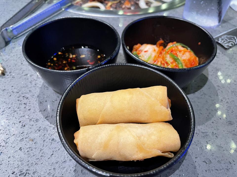 Egg rolls, chili sauce and kimchi at KPot Korean BBQ & Hot Pot in Toms River.