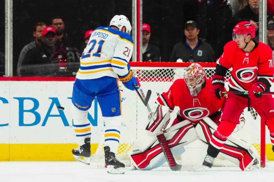 Carolina Hurricanes goaltender Antti Raanta (32) and Buffalo Sabres right wing Kyle Okposo (21) watch the shot during the first period at PNC Arena.
