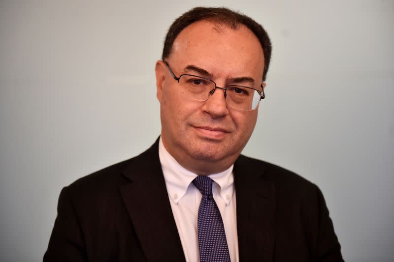 FILE PHOTO: Andrew Bailey, CEO of the Financial Conduct Authority, poses for a photo as he arrives at the Reuters offices for an interview in London