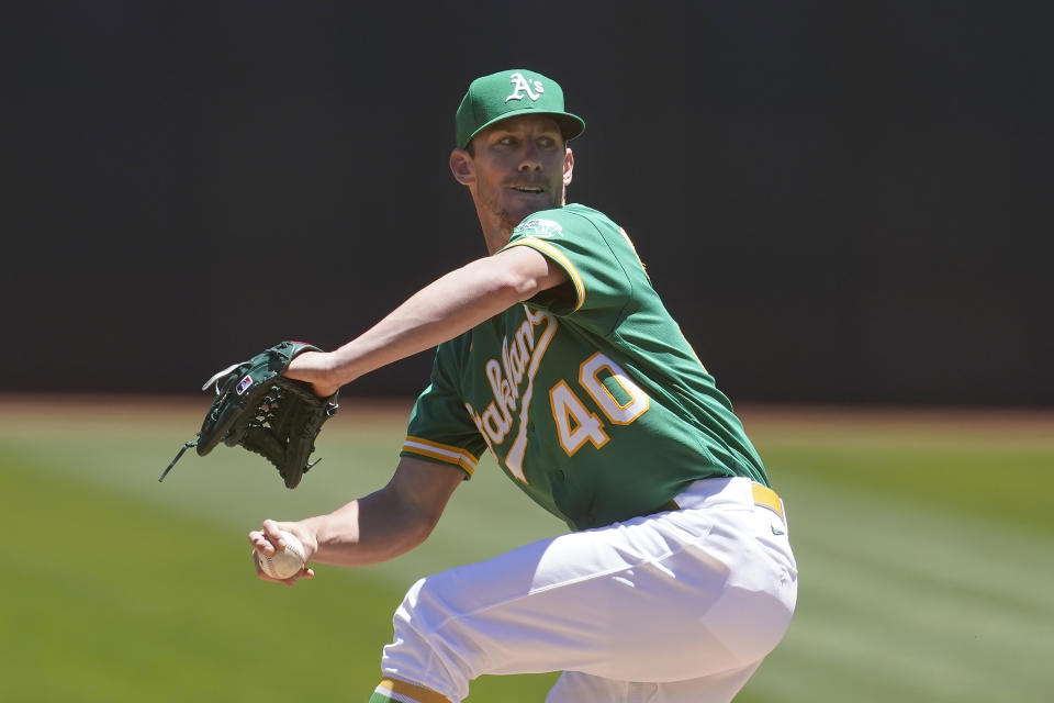 Oakland Athletics' Chris Bassitt pitches against the Kansas City Royals during the first inning of a baseball game in Oakland, Calif., Sunday, June 13, 2021. (AP Photo/Jeff Chiu)