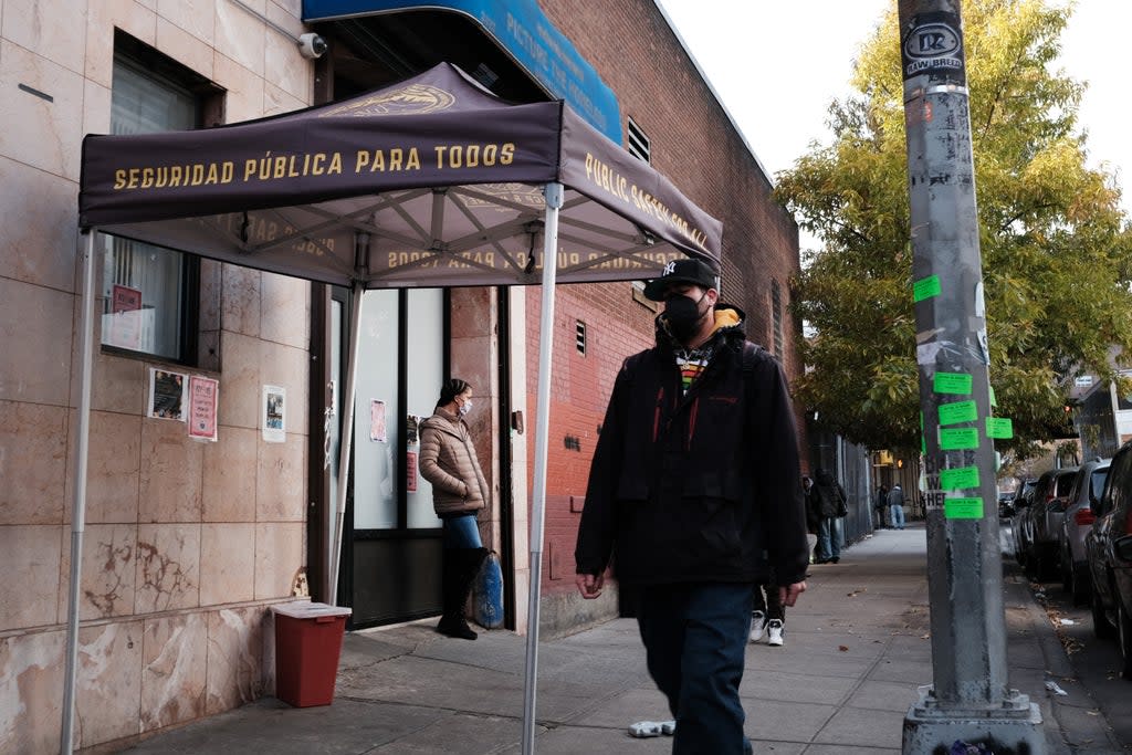 People walk past an East Harlem health clinic that houses an overdose prevention room for drug users to consume under supervision (Getty)