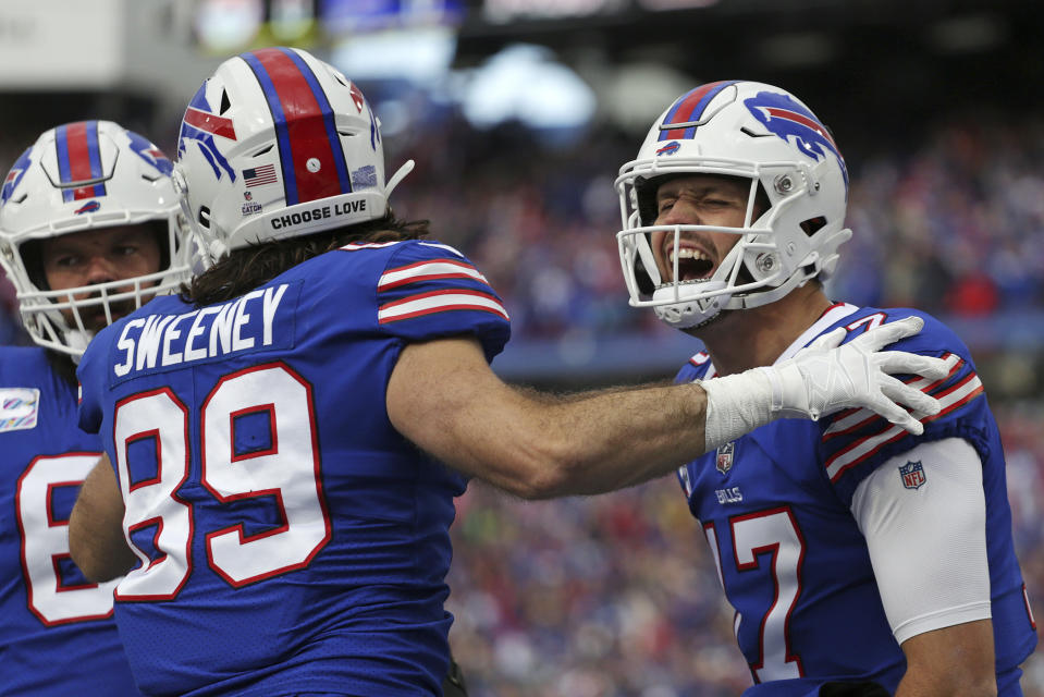 Buffalo Bills quarterback Josh Allen (17) celebrates a touchdown pass to Buffalo Bills wide receiver Gabe Davis during the first half of an NFL football game against the Pittsburgh Steelers in Orchard Park, N.Y., Sunday, Oct. 9, 2022. (AP Photo/Joshua Bessex)