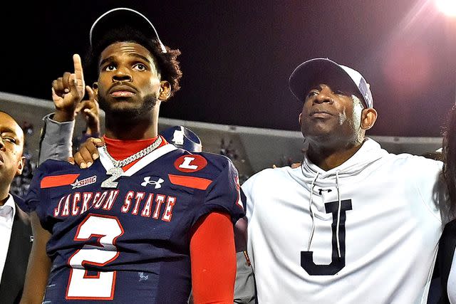 <p>Justin Ford/Getty</p> Deion Sanders and son Shedeur Sanders attend Jackson State football game