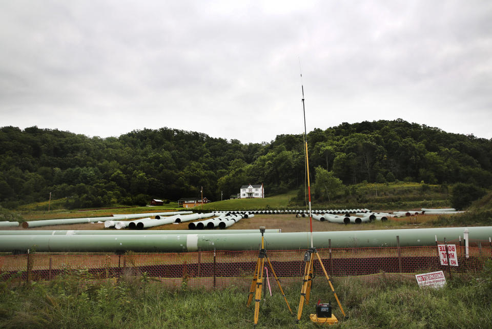 FILE - Sections of pipe for the Mountain Valley Pipeline are seen lined up on Sept. 15, 2020, in Elliston, Va. The U.S. Forest Service has reissued approval for the controversial and long-delayed natural gas pipeline to run through Jefferson National Forest in Virginia and West Virginia. The decision on Monday, May 15, 2023, will allow for construction of the $6.6 billion Mountain Valley Pipeline across a 3.5-mile corridor of the national forest. (Heather Rousseau/The Roanoke Times via AP, File)