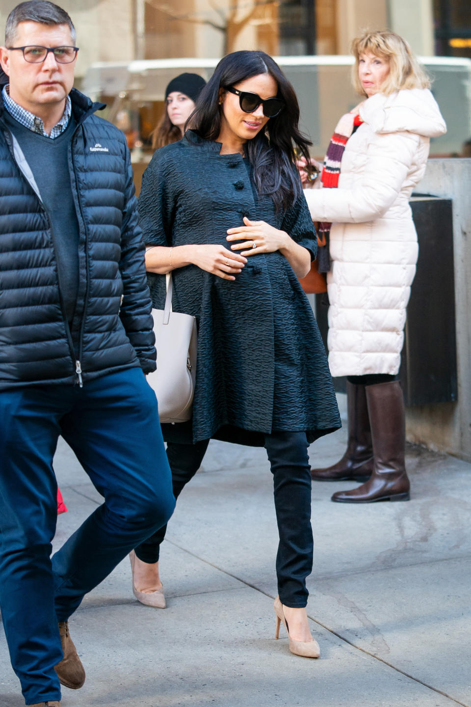 Meghan walking around New York's Upper East Side, accompanied by her security detail.&nbsp; (Photo: Gotham via Getty Images)