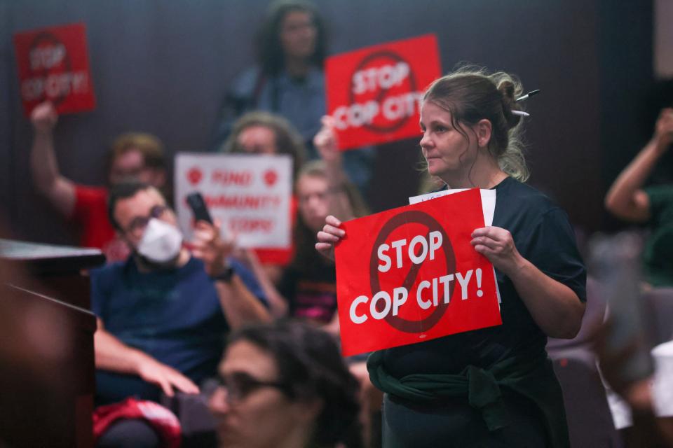 Protestors react before council members voted 11-4 to approve legislation to fund the Atlanta Public Safety Training Center on June 6 in Atlanta.