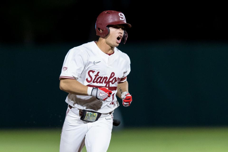 Stanford's Tommy Troy (12) runs the bases after hitting a solo home run against Connecticut during the ninth inning of an NCAA college baseball tournament super regional game Saturday, June 11, 2022, in Stanford, Calif. Connecticut won 13-12. (AP Photo/John Hefti)