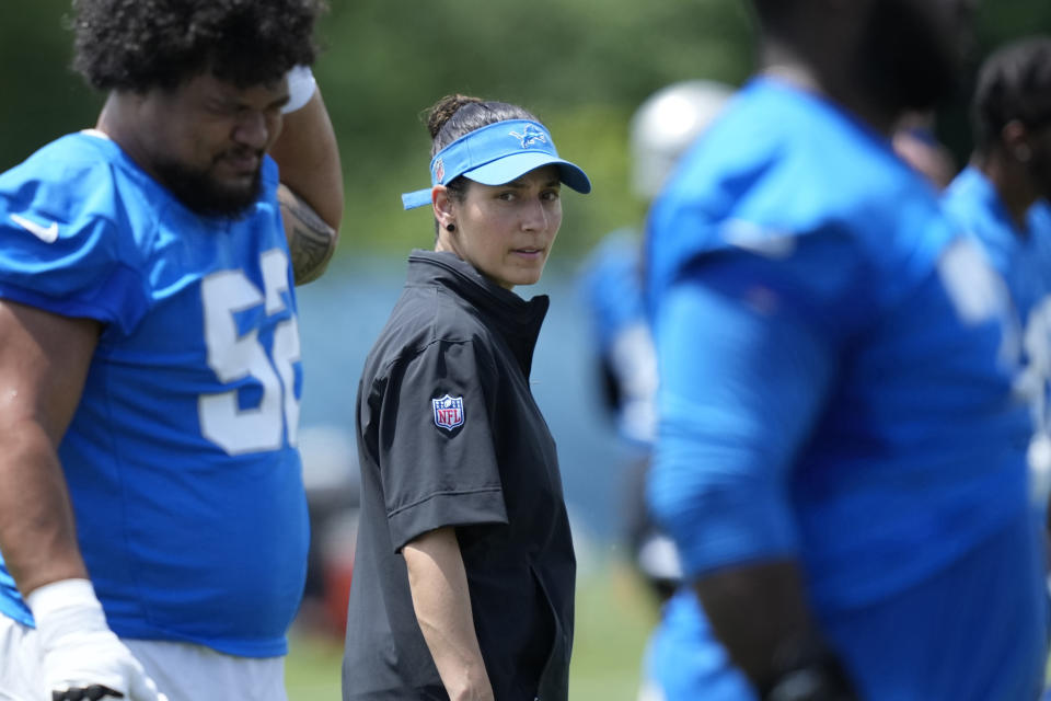 Detroit Lions Director of Sports Medicine Jill Costanza watches an NFL football practice, Tuesday, June 4, 2024, in Allen Park, Mich. Costanza’s interest in studying ACL injuries and passion for learning new ways to improve performance led the former high school basketball coach and PE teacher on a journey from college sports to the Army to the Air Force to the NFL. Now, she’s an asset for a team with Super Bowl aspirations. (AP Photo/Carlos Osorio)