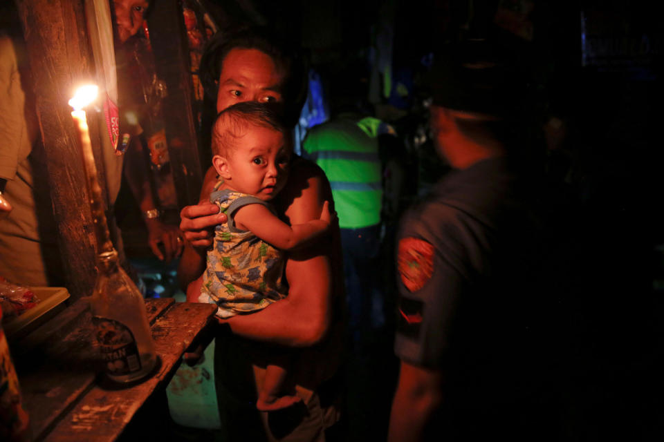 Police searches a slum during a drug raid in Manila Philippines