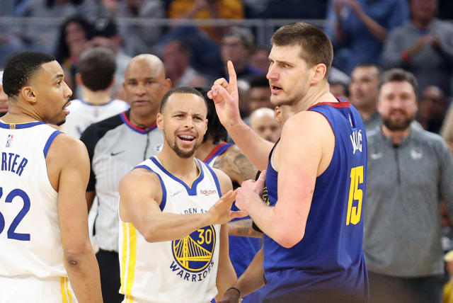 Stephen Curry of the Golden State Warriors has words with Nikola Jokic of the Denver Nuggets
