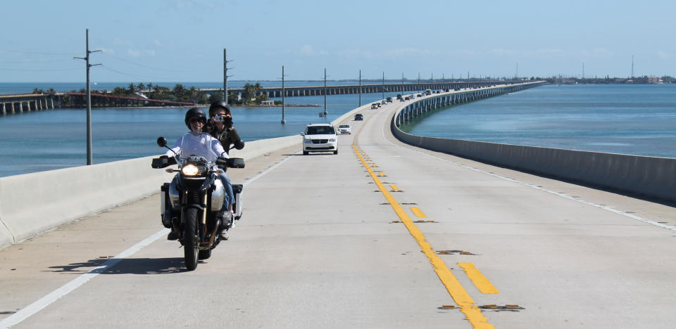 In this February 2012 photo motorcyclists ride on Seven Mile Bridge along the Overseas Highway, U.S. 1, which connects Knight's Key in Marathon, Fla. with Little Duck Key. (AP Photo/Glenn Adams)