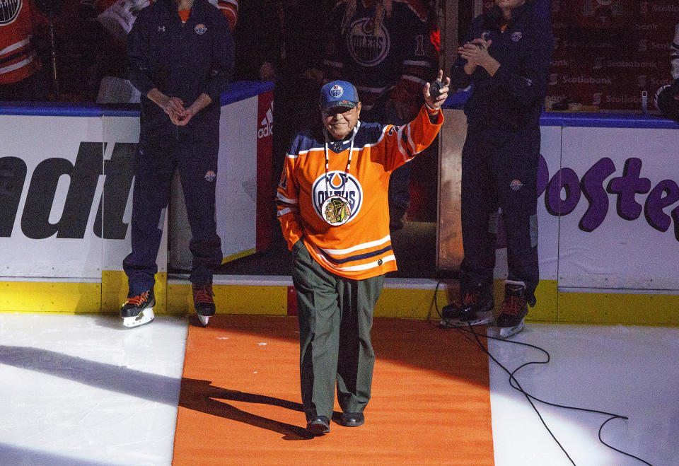 FILE - Former Chicago Blackhawks player Fred Sasakamoose is honored at the Edmonton Oilers-Chicago Blackhawks NHL hockey game Dec. 29, 2017, in Edmonton, Alberta. Sasakamoose is recognized as becoming the league's first Canadian aboriginal player in 1953, and he turned into a First Nations hero. But historians and the Hall of Fame would give that distinction to Mohawk player Paul Jacobs if he played in a game during the 1918-19 season. (Jason Franson/The Canadian Press via AP, File)