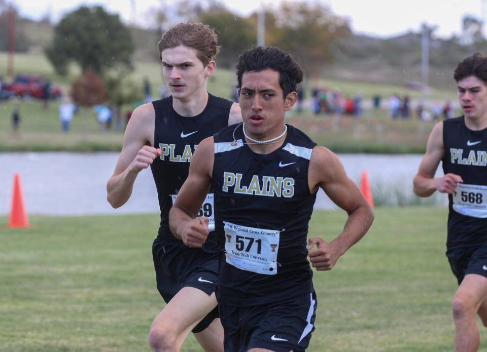 Plains runners Sawyer Hamilton (left) and Jhoan Menjivar eye the competition in the Region I-2A cross country meet on Monday, Oct. 24, 2022 at Mae Simmons Park.