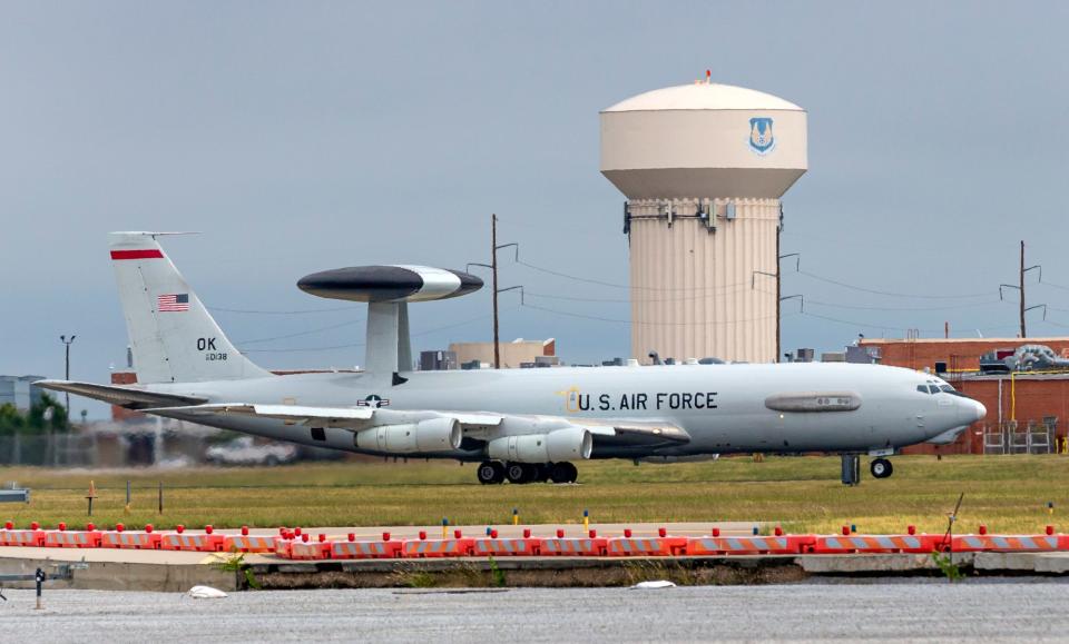 A Boeing 707 AWACS aircraft makes its way down the runway for flight at Tinker Air Force Base.