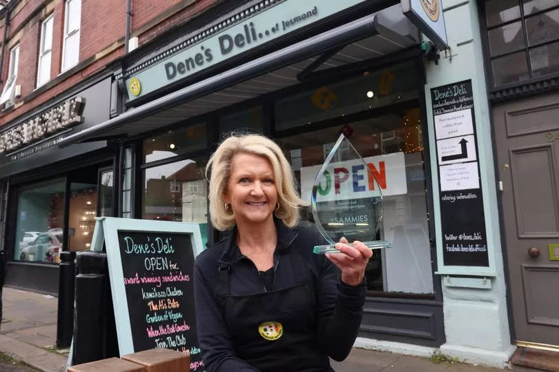 Gill Reeve owner of Dene's Deli with the Sammies' award.