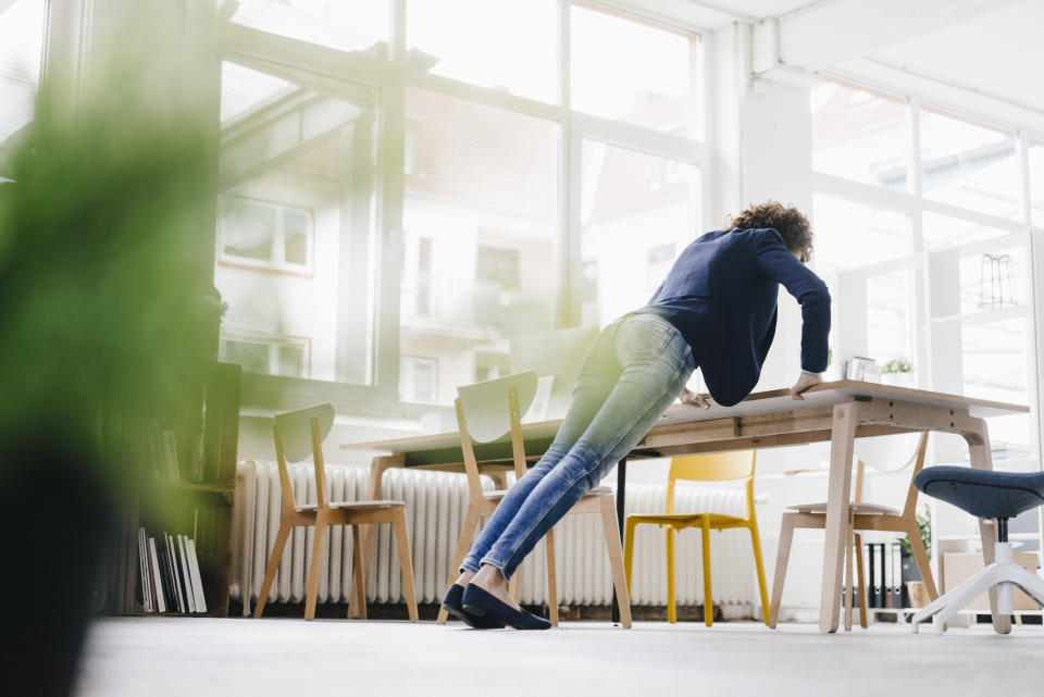 woman doing desk push up