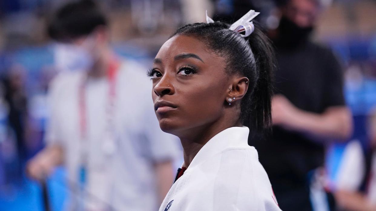 Simone Biles looks on during the Tokyo Olympics.