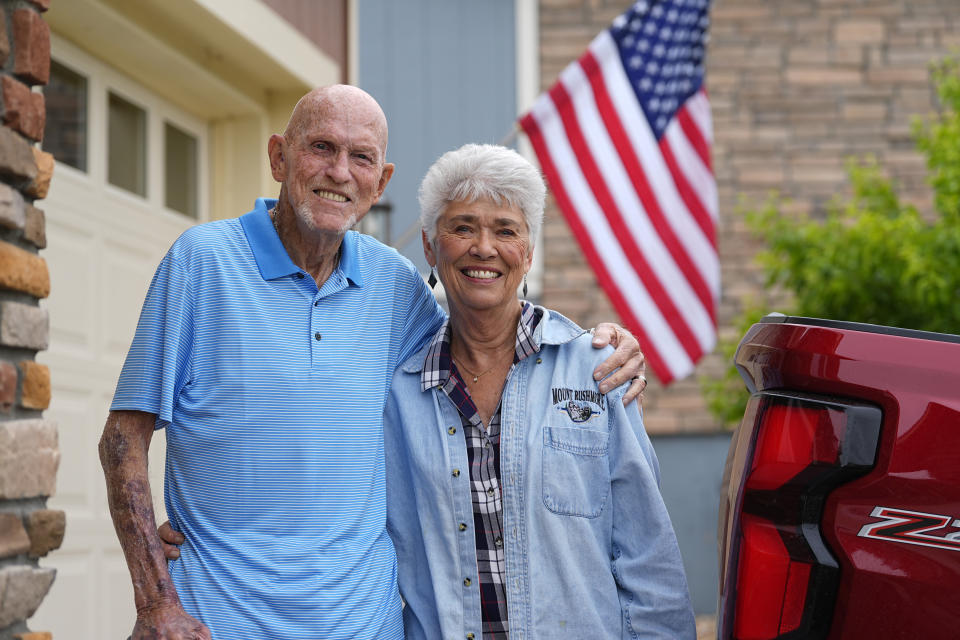 Tom McAdam and his wife, Beverly, stand outside their home Friday, May 31, 2024, in Broomfield, Colo. The retired couple's home in the northwest Denver suburb has risen 45 percent in value since purchasing six years ago that has increased their property tax. The couple is backing a Colorado ballot proposal that could cap the growth of property tax revenue, one of several measures in states this year to limit, cut or offset escalating property taxes in response to the complaints of residents. (AP Photo/David Zalubowski)