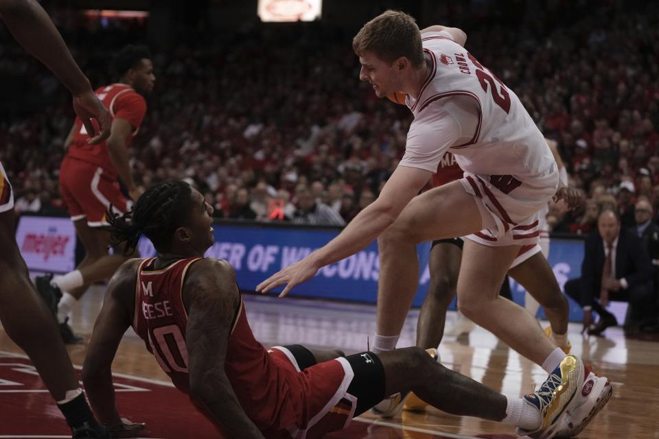 Wisconsin's Steven Crowl fouls Maryland's Julian Reese during the second half of an NCAA college basketball game Tuesday, Feb. 20, 2024, in Madison, Wis. (AP Photo/Morry Gash)