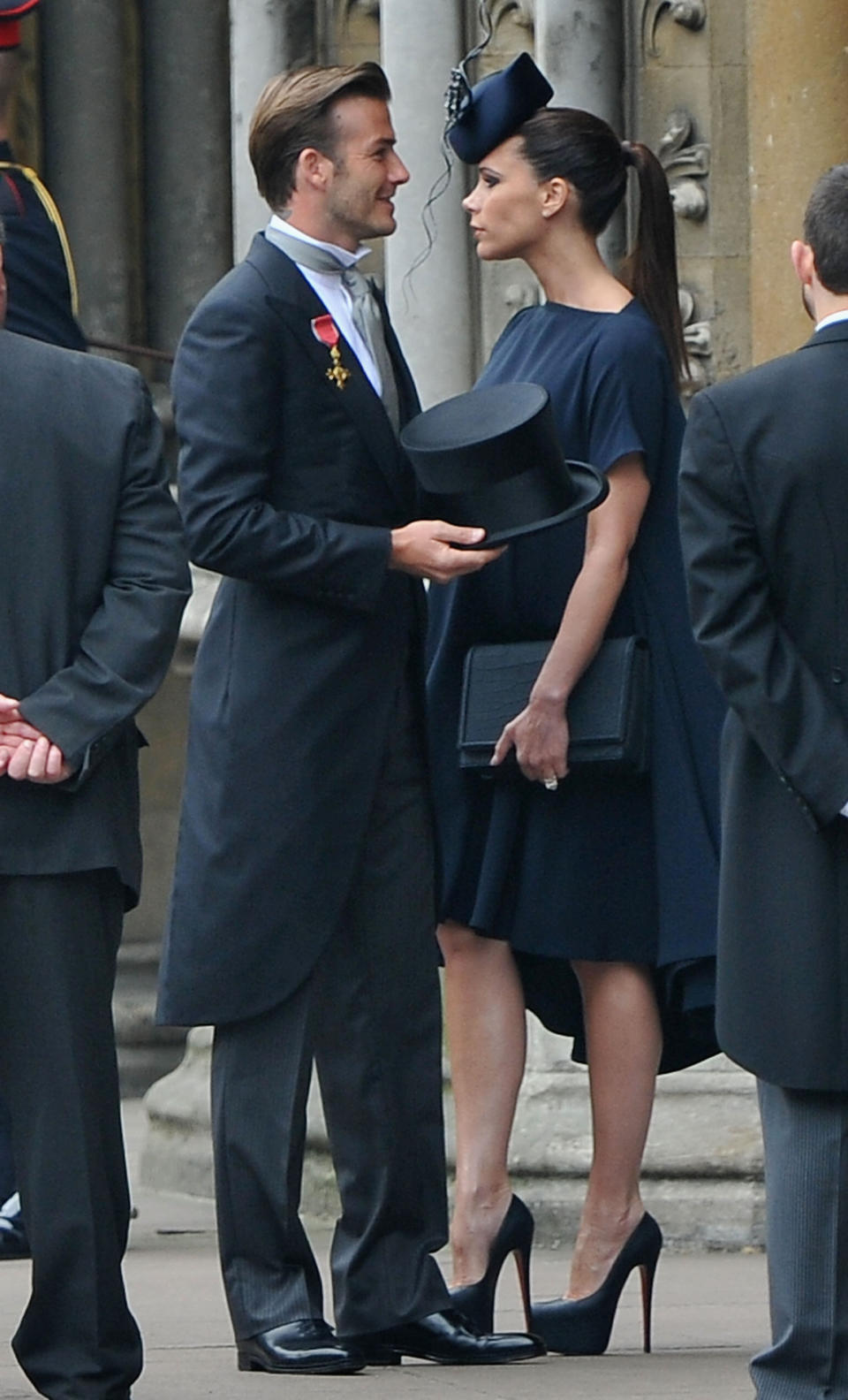 David and Victoria Beckham in theatrical hats