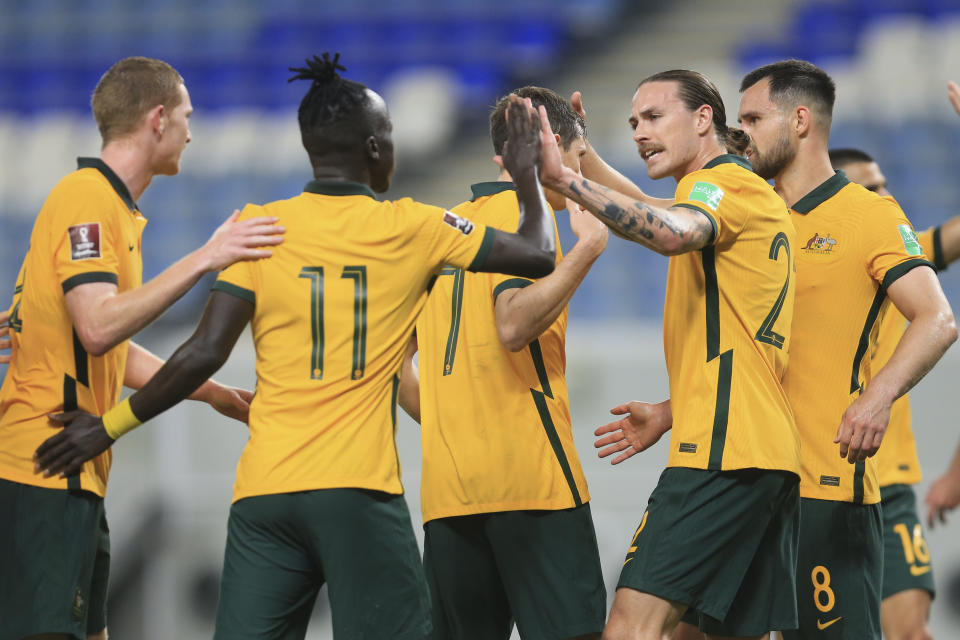 Australia's players celebrate after a goal during a friendly soccer match between Jordan and Australia in Doha, Qatar, Wednesday, June 1, 2022. (AP Photo/Hussein Sayed)