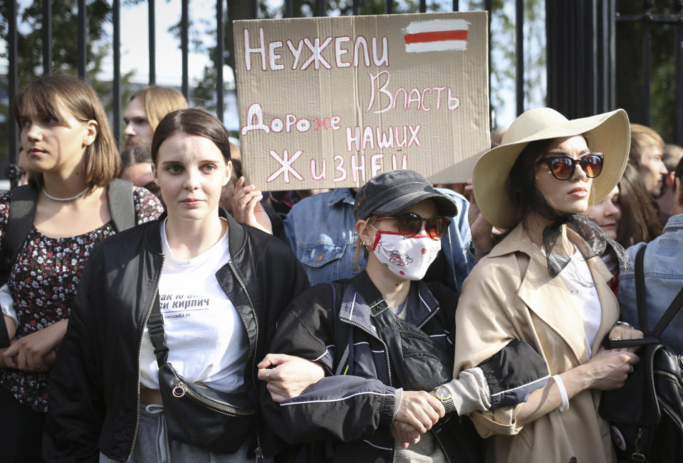 Belarus students with a banner reading "Is power more precious than our lives?", attend a rally in Minsk, Belarus, Tuesday, Sept. 1, 2020. Several hundred students on Tuesday gathered in Minsk and marched through the city center, demanding the resignation of the country's authoritarian leader after an election the opposition denounced as rigged. Many have been detained as police moved to break up the crowds. (Tut.By via AP)