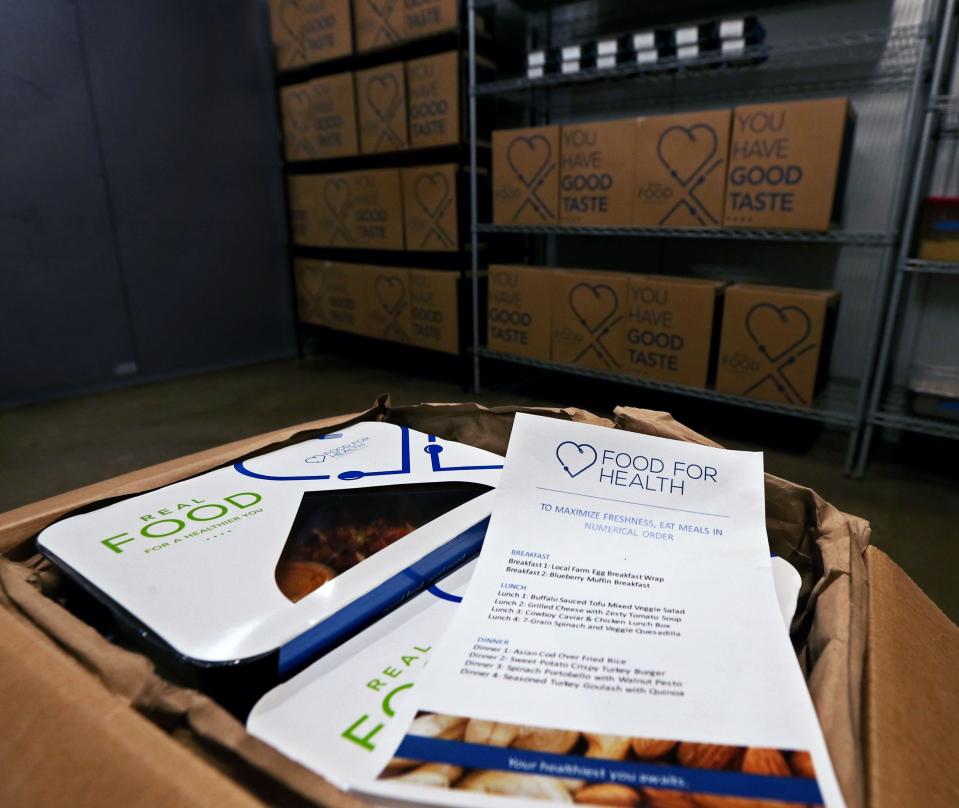 A box shows how meals are package for the Food For Health program.