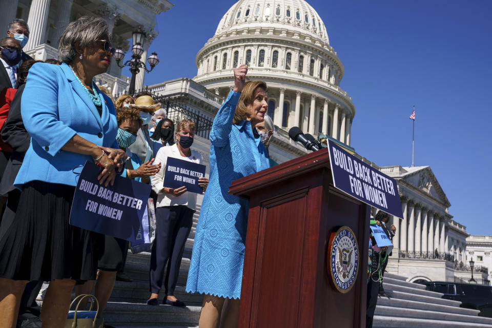 FILE - In this Sept. 24, 2021, file photo House Speaker Nancy Pelosi, D-Calif., joined at left by Rep. Brenda Lawrence, D-Mich., holds a rally in support of President Joe Biden's "Build Back Better" for women agenda, at the Capitol in Washington. Biden is losing support among critical groups in his political base as some of his core campaign promises falter, raising concerns among Democrats that the voters who put him in office may feel less enthusiastic about returning to the polls in next year's midterm elections. (AP Photo/J. Scott Applewhite, File)