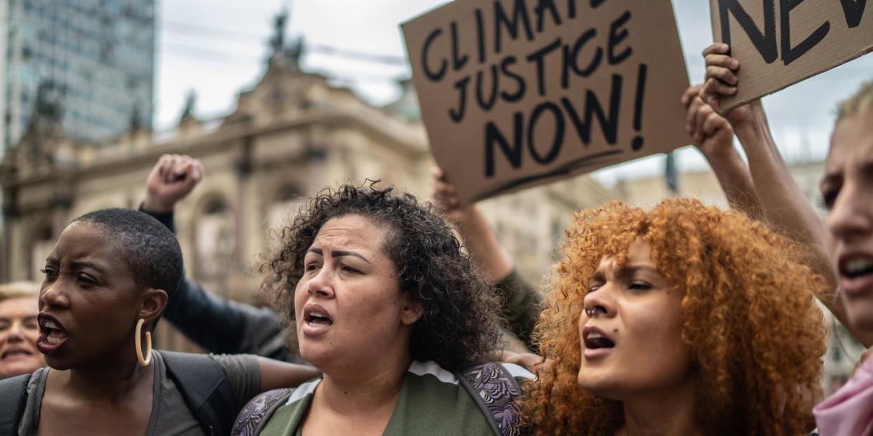 what is environmental racism 3 women protesting climate injustice