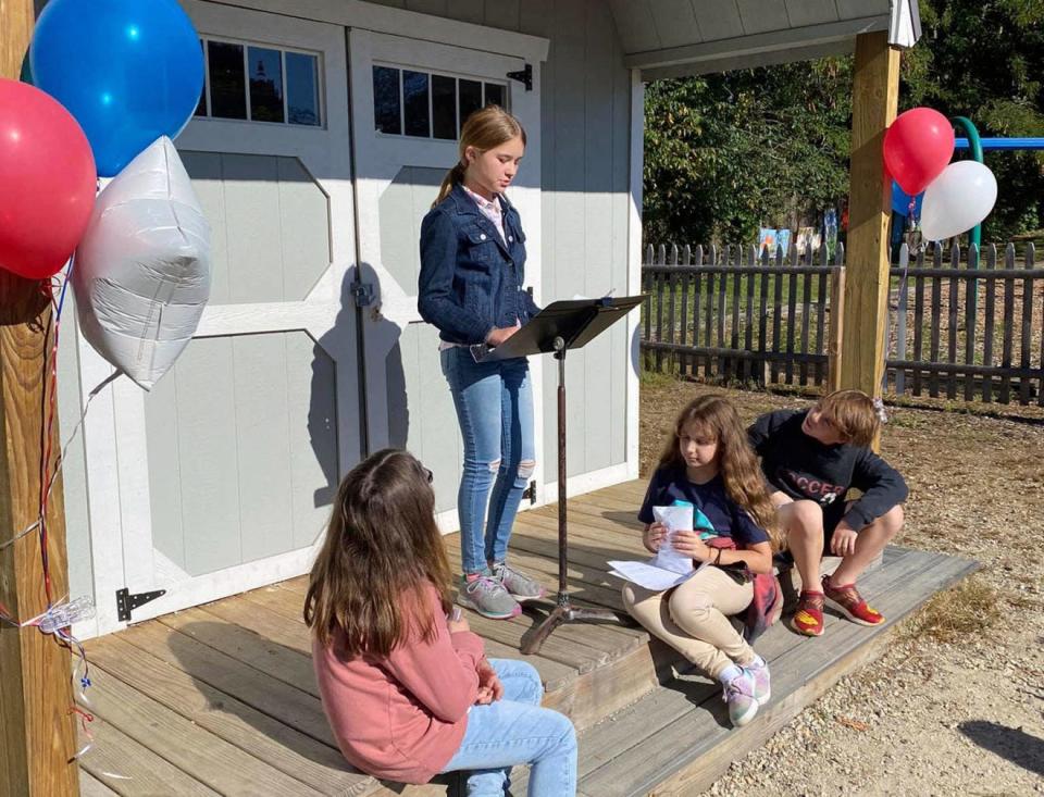 Maple Street Magnet School 5th Grade student Layla Bernard gives a presentation in an outdoor learning space for Kid Governor this fall.