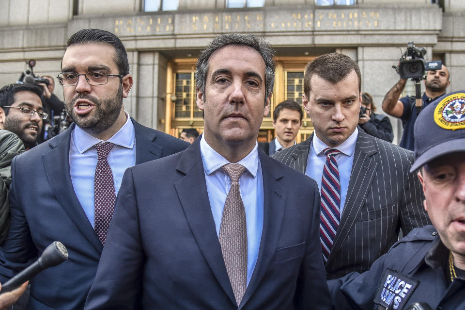 President Trump’s personal lawyer, Michael Cohen, center, leaves a courthouse in New York on April 26, 2018. (Photo: Hector Retamal/AFP/Getty Images)