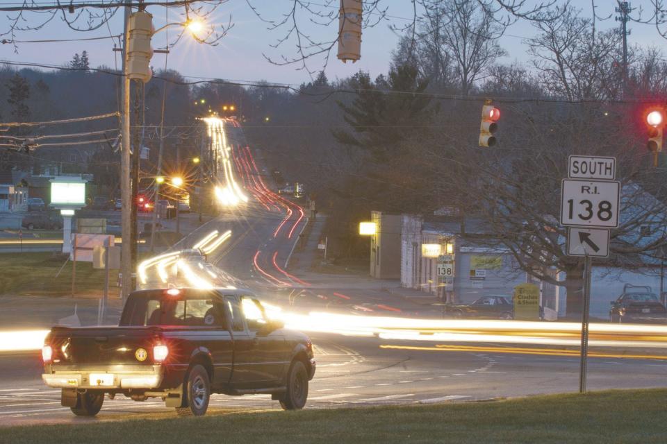 Traffic is a blur on East Main Road at the corner of Turnpike Avenue in Portsmouth during rush hour in 2016. State officials have considered several options, including roundabouts, to calm traffic in the area.