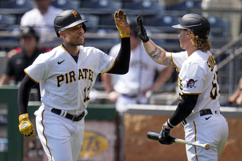 Pittsburgh Pirates' Ke'Bryan Hayes, left, is greeted by Jack Suwinski as he returns to the dugout after hitting a solo home run off Milwaukee Brewers starting pitcher Freddy Peralta during the first inning of a baseball game in Pittsburgh, Wednesday, Sept. 6, 2023. (AP Photo/Gene J. Puskar)