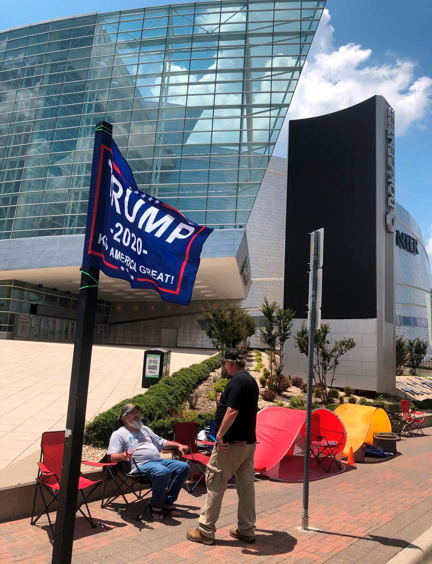 James Massery, left, of Preston, Okla., and Daniel Hedman, of Tulsa, Okla., supporters of President Donald Trump, camp outside the BOK Center in Tulsa on Tuesday, June 16, 2020, four days before his scheduled rally Saturday.