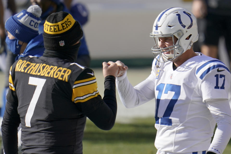 Pittsburgh Steelers quarterback Ben Roethlisberger (7) greets Indianapolis Colts quarterback Philip Rivers (17) as the teams warm up before an NFL football game Sunday, Dec. 27, 2020, in Pittsburgh. (AP Photo/Gene J. Puskar)