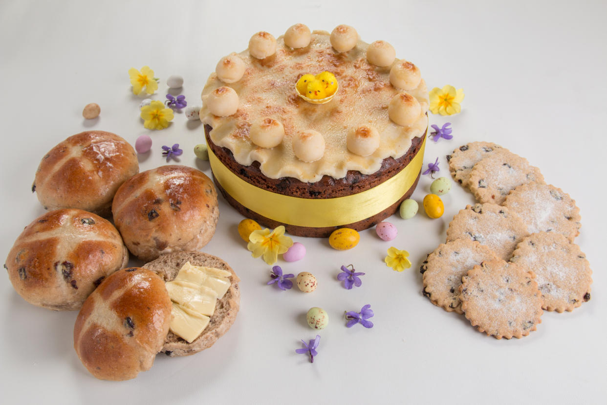 This Easter it's all about hot cross buns and Simnel cake. (Getty Images)