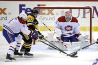 FILE - In this Feb. 14, 2020, file photo, Pittsburgh Penguins' Sidney Crosby (87) can't deflect a shot in front of Montreal Canadiens goaltender Carey Price (31) with Ben Chiarot (8) defending during the third period of an NHL hockey game in Pittsburgh. Crosby doesn't mind going directly into playoffs given the limited timing. His reward is a matchup against elite goaltender Price and the Canadiens. (AP Photo/Gene J. Puskar, File)