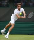 <p>Gilles Simon of France plays a backhand during the Men’s Singles second round match against Grigor Dimitrov of Bulgaria on day four of the Wimbledon Lawn Tennis Championships at the All England Lawn Tennis and Croquet Club on June 30, 2016 in London, England. (Photo by Julian Finney/Getty Images)</p>