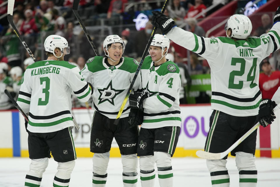 Dallas Stars left wing Jason Robertson, second from left, celebrates his goal against the Detroit Red Wings in the third period of an NHL hockey game Friday, Jan. 21, 2022, in Detroit. (AP Photo/Paul Sancya)