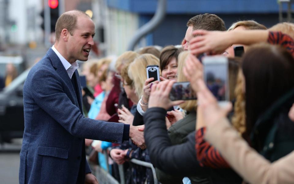 The Duke of Cambridge greets crowds gathered outside the Braid Arts Centre in Ballymena - PA
