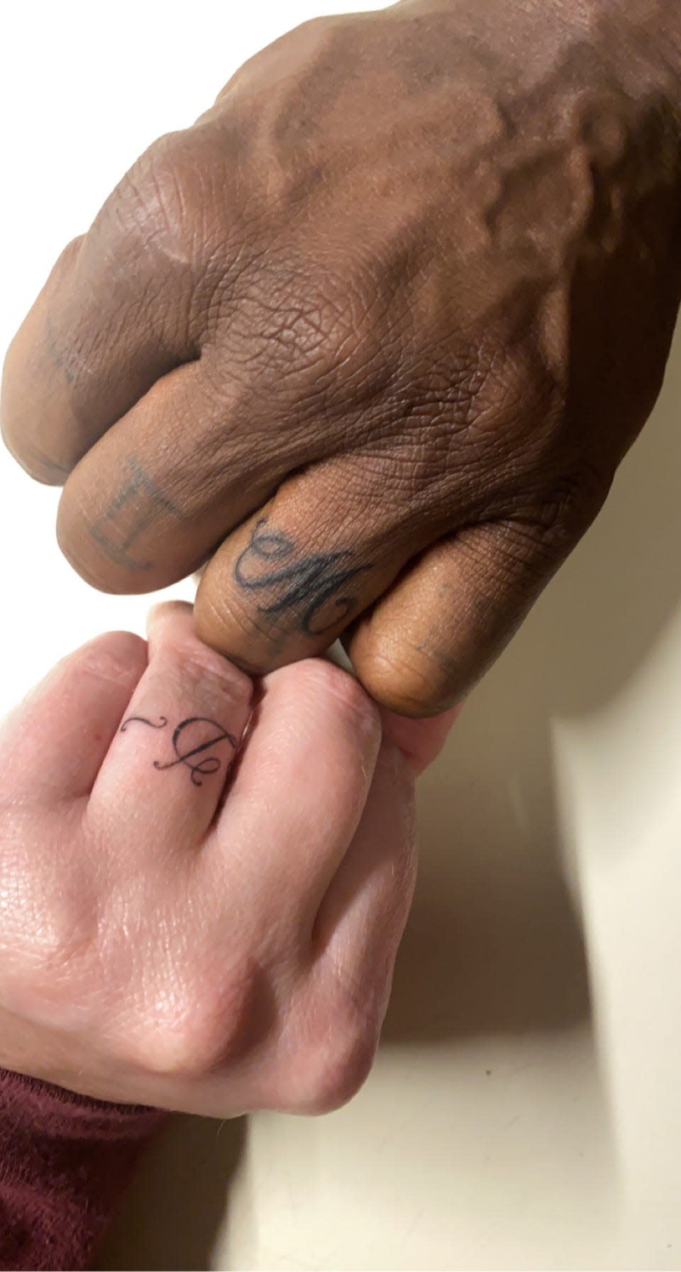 Miranda Koons and her fiance, Devon May, chose to tattoo their initials on their ring fingers, forgoing wedding bands.