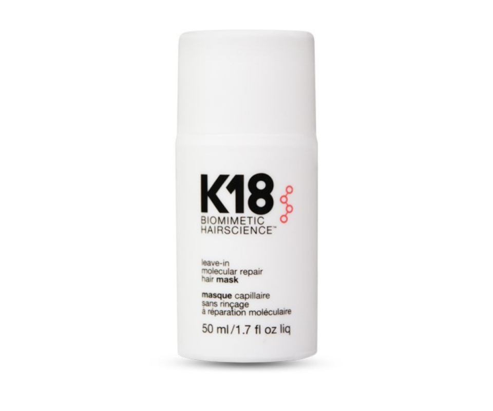 A white capped bottle of the K18 leave-in hair mask against a white background.