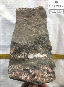 Figure 7: Gayna River ’G’ showing, sample 3200026. Lower-Host angular dolostone breccia. Matrix infilled with dolomite, disseminated crystalline yellow and red sphalerite, and pyrite.